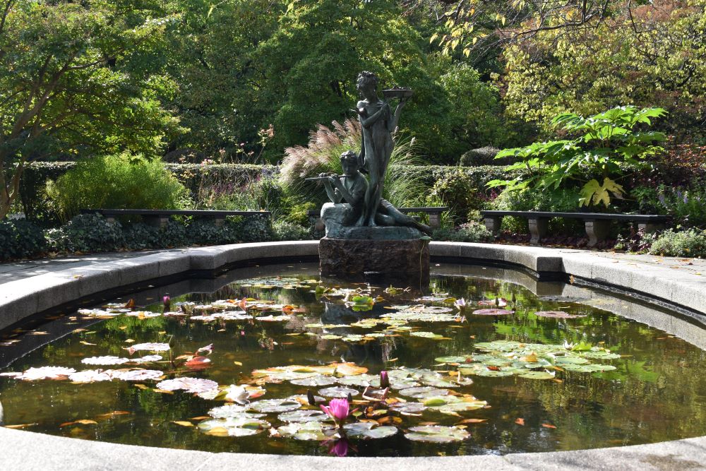 A photo of a statue of a boy and a girl in Central Park, NYC compliments the description of couples therapy, a service offered by Josh Stieber, PhD at Winding Elm Psychotherapy.