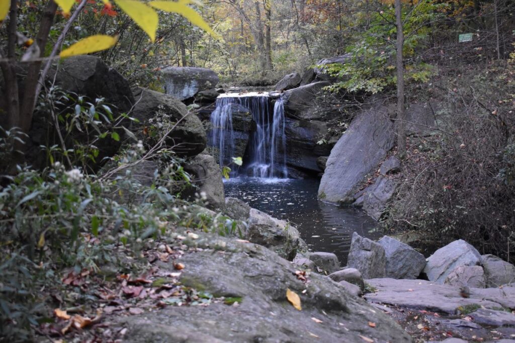 A photo of a waterfall in Central Park, NYC symbolizes refreshment through spirituality support, a serviced offered by Josh Stieber, PhD at Winding Elm Psychotherapy.